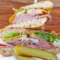 Roast Beef Sandwich · Roasted beef, pickles, caramelized onion, lettuce, cheddar cheese, focaccia and horseradish ...