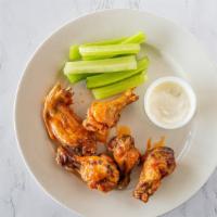 Wings · Choice of hot, mild or BBQ sauce. Served with Blue cheese.