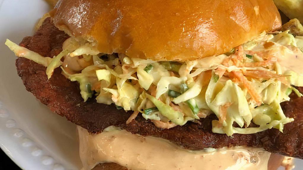 Nashville Hot Fried Chicken Sandwich · Buttermilk fried chicken coated in our Nashville hot seasoning. Topped with our sweet and spicy slaw, sriracha mayonnaise, and served on a toasted bun.