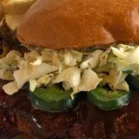 Bbq Fried Chicken Sandwich · Buttermilk fried chicken, BBQ sauce, jalapenos, cabbage slaw, and served on a toasted bun.