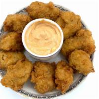 10 Piece Fried Chicken Bites · Crunchy pieces of heaven. Choose 2 sauces or choose more for a small fee.