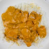 Butter Chicken · Chicken thigh cooked in a creamy tomato sauce (makhani).