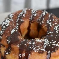 Donut French Toast · Two of our famous honey dipped donuts dipped in our signature french toast dip and griddled....
