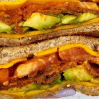 Vegan Hummus Blt · Plant based bacon(Sweet Earth), lettuce, tomatoes and hummus on multigrain toast. Served wit...