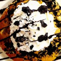 Cookies And Cream Pancakes · Oreo Cookies, whipped cream and chocolate drizzle.
