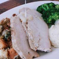 Roasted Turkey Dinner · Roasted turkey, stuffing, broccoli, creamy mashed, cranberry sauce and turkey gravy.