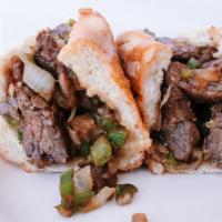Steak Tip Sub · Marinated steak tips griddled with onions and peppers.