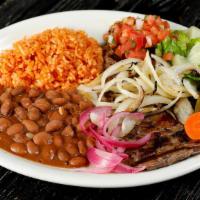 Carne Asada · Grilled steak. Served with rice, beans, salad, and two tortillas.