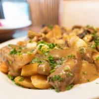 Poutine · house made gravy / Wisconsin cheese curds / braised pork / fries
