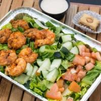 Grilled Shrimp On A Bed Of Mediterranean Rice & Salad · Our grilled jumbo royal shrimp come on a bed of mediterranean rice & salad drizzled with you...