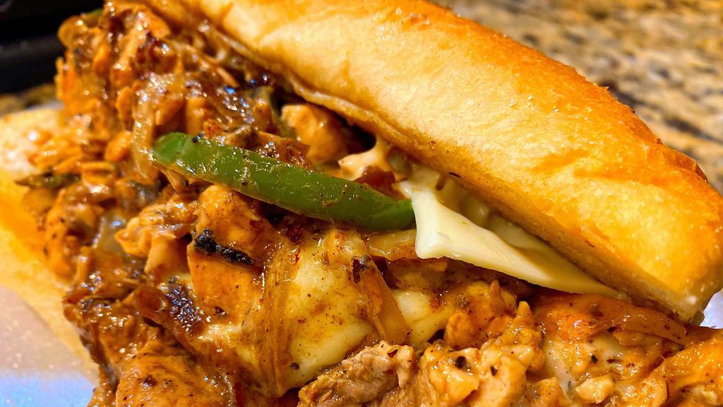 Jerk Salmon Cheesesteak Large · Chopped Salmon, Onions, Peppers, American Cheese and Jerk Sauce