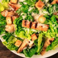 Caesar Salad · Crisp romaine tossed with croutons, caesar dressing, and grated cheese.