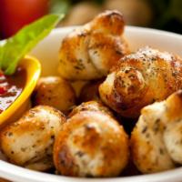 Garlic Knots · 5 Pieces. A classic snack, our garlic knots are strips of pizza dough tied in a knot, baked,...