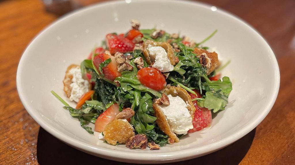 Strawberry Fields · warmed almond-crusted goat cheese over baby kale, arugula, grape tomatoes, strawberries and candied pecans, tossed in champagne vinaigrette