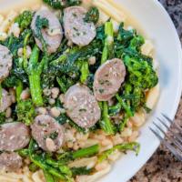 Sausage Cavatelli Rabe And Beans · Sweet Italian sausage sautéed in olive oil, white cannellini beans & broccoli rabe seasoned ...