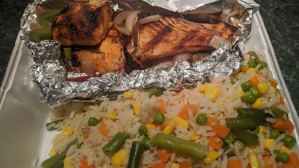 Grilled Salmon · Served with rice and salad.