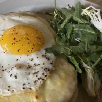 Croque Madame · slow-cooked ham, swiss gruyere, fried egg, herb salad.