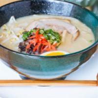 Green Curry Ramen Chashu · Spicy green curry flavor infused with tonkotsu broth topped with your choice above, half-boi...