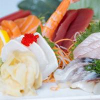 Sushi / Sashimi Combo · Six pieces of sushi assortment, nine pieces sashimi, and one spicy tuna chrunchy roll.