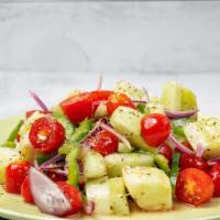 Aggourontomata (Cucumber And Tomato Salad) · Tomatoes, cucumbers, red onions, green peppers, and extra virgin olive oil.