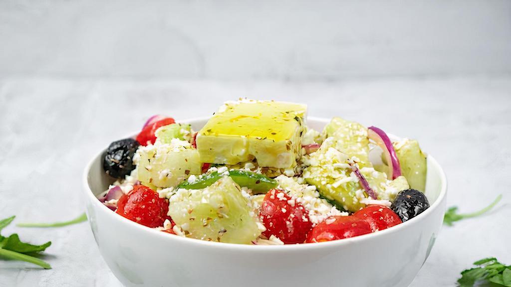 Side Village Salad · Tomatoes, cucumbers, red onions, green peppers, feta cheese, olives, and extra virgin olive oil.