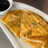 Scallion Pancake · Gluten free. Rice flour stuffed with scallions served with ginger sauce.