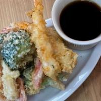 Tempura · Shrimp and vegetables deep-fried in light batter served with tempura sauce.