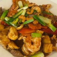 Pad Paradise · Medium. Sautéed beef, chicken and shrimps with cashew nuts, red peppers, carrots, basil, pin...