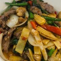 Beef Typhoon · Medium. Sautéed beef with bamboo shoots, minced hot peppers, garlic, baby corn, mushrooms, s...