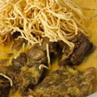 Khao Soi Noodle Soup · Beef, red onion, lime, cilantro and egg noodles in curry sauce.