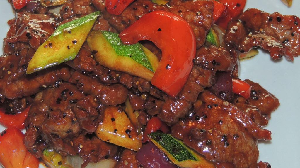 Black Pepper Beef · Sliced beef with onion, green and red pepper and zucchini sautéed with unique black pepper.