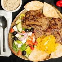 Grilled Beef · Grilled beef, rice, Greek salad, pita bread, tahini, Baba ghanouj, and soup.