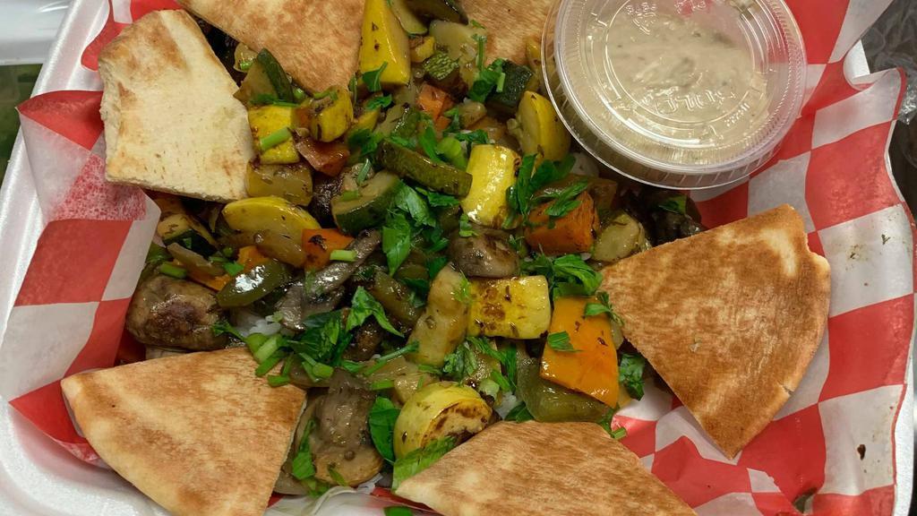 Grilled Vegetables · Zucchini, yellow squash, mushrooms, eggplant, colored peppers, onions, tomatoes, baba ghanouj, and rice.