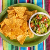 Guacamole Tradicional Con Tortilla Chips · Vegan. Jalapeno, onion, cilantro, and lime.