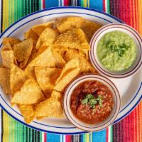 Chips & Salsa · Vegan. Our house-made roja and Verde salsas with our chips fried in house!.