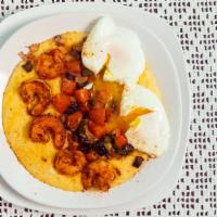 Shrimp & Grits · Creamy cheddar cheese grits, Cajun shrimp, peppers, onions and tomatoes, topped with two poa...