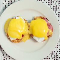 Eggs Benedict · Canadian bacon, poached eggs, hollandaise sauce, English muffin, home fries.
