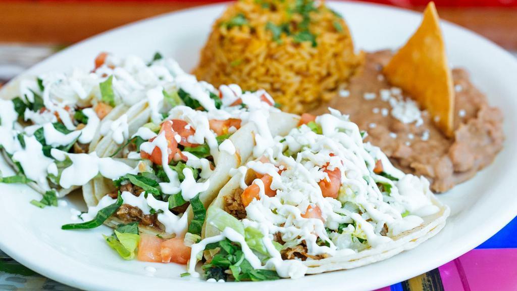 Taco Platter · 3 tacos with your choice of meat served with Mexican rice and beans. All tacos are topped with cilantro and onions or make it supreme. Your choice of soft corn, crunchy or flour tortilla.