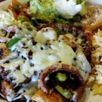 Alambres · Grilled onions, peppers, and bacon smothered with oaxaca cheese, and served with Mexican ric...