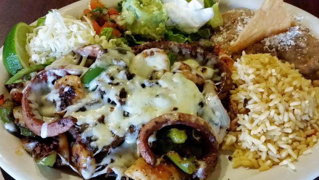 Alambres · Grilled onions, peppers, and bacon smothered with oaxaca cheese, and served with Mexican rice, beans, and fluor tortilla.