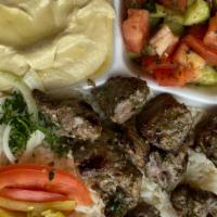 Lamb Kebab Plate · Lamb kebab over bed of rice and choice of 2 sides