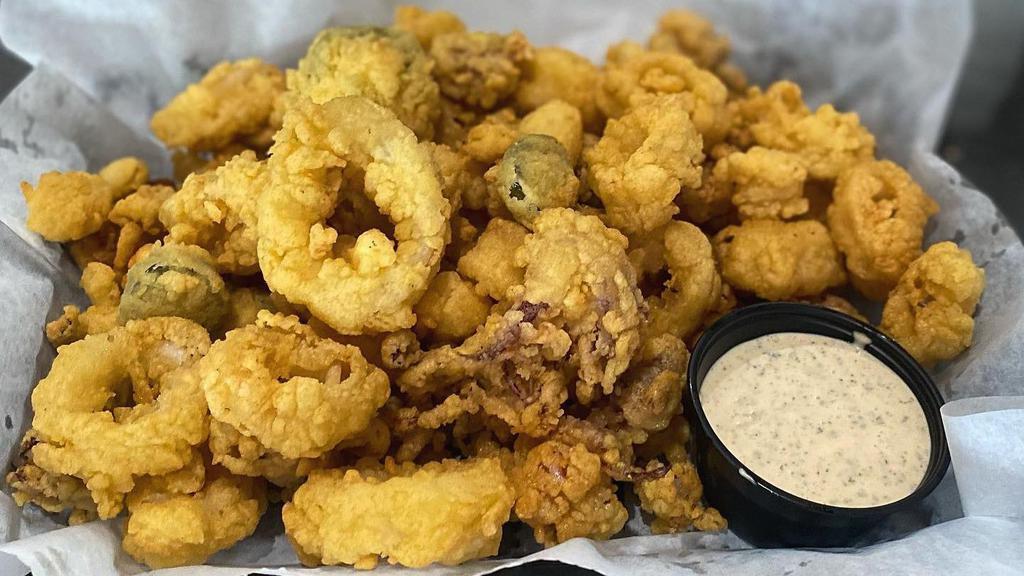 Island Calamari · Lightly hand-breaded, fried golden brown, served with our housemade Cajun remoulade dipping sauce.