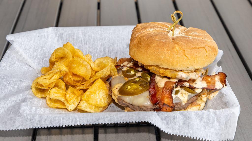 Fiery Burger · Layered with bacon, jalapeno peppers, onion rings. provolone cheese, and our house-made Cajun remoulade sauce.