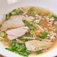 Soupe Phnom-Penh · The traditional khmer noodle soup with pork, bean sprouts, herbs and fried garlic.