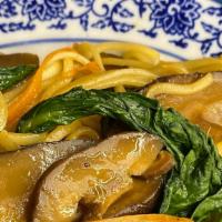 Vegan Wok Noodles · Wheat Noodles, carrots, onions, seasonal greens, & soy ginger sauce.