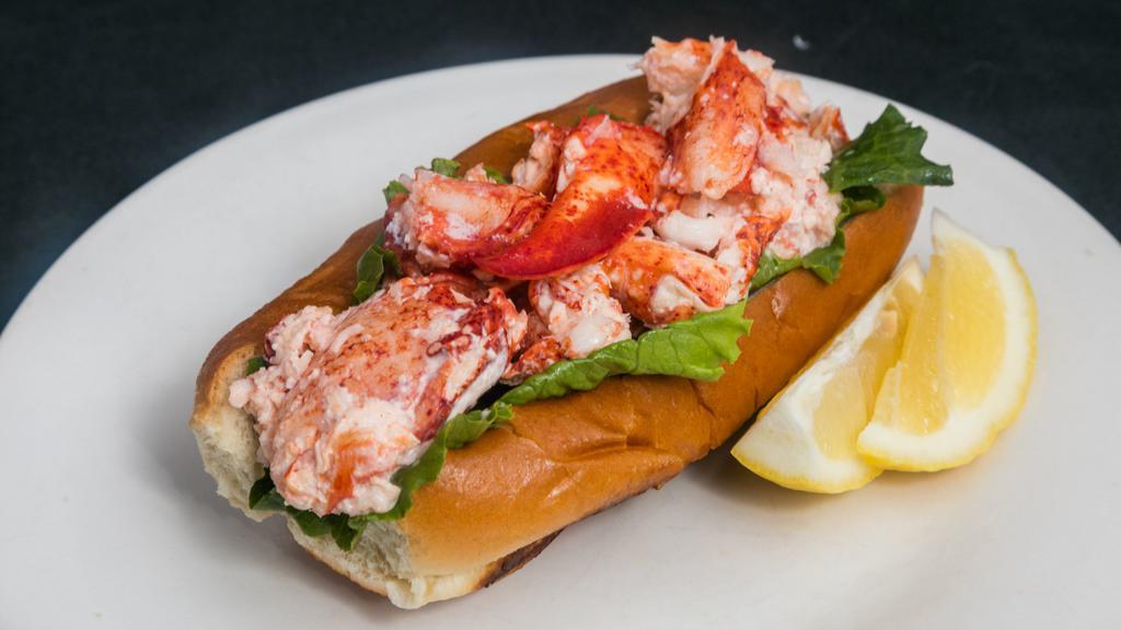 Lobster Roll · Seasonal lobster lightly tossed in mayonnaise. Or warm buttered lobster, no mayonnaise. Served on grilled brioche with lettuce.