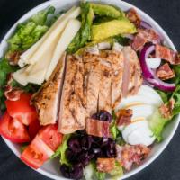 Chicken Cobb Salad · Grilled chicken, hard boiled egg, bacon, tomato, red onion, kalamata olives, swiss cheese, s...