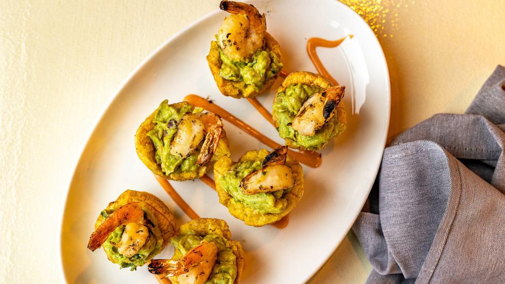 Shrimp Plantain Guacamole Bites · Marinated shrimp served atop hand crafted plantain cups, stuffed with freshly made guacamole.