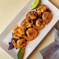 Chili Lime Grilled Shrimp · Chili and lime marinated shrimp grilled to perfection. Served atop crispy red cabbage.