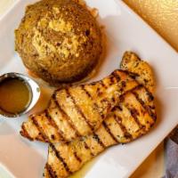 Mofongo · Fried plantains, hand-mashed along with garlic butter and fried pork shoulder. Your choice o...